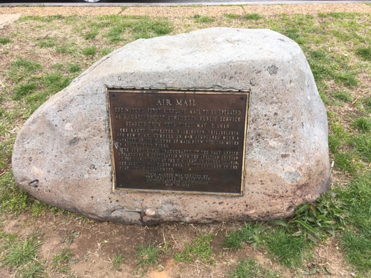 First Air Mail Flight Marker stone next to the sidewalk on Ohio Drive SW